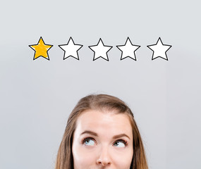 One star rating with young woman looking upwards
