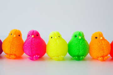 Colorful Rubber Rucks in a Row on White Background