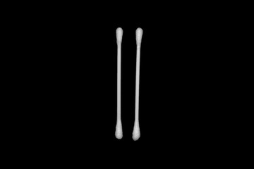 White cotton buds isolated on black background