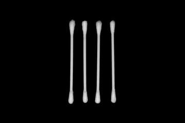 White cotton buds isolated on black background