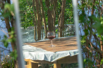 glass of red wine in mirror