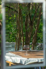 glass of red wine in mirror