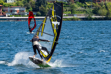 Windsurfer jumping on lake Como