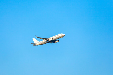 Passenger plane in the blue sky.