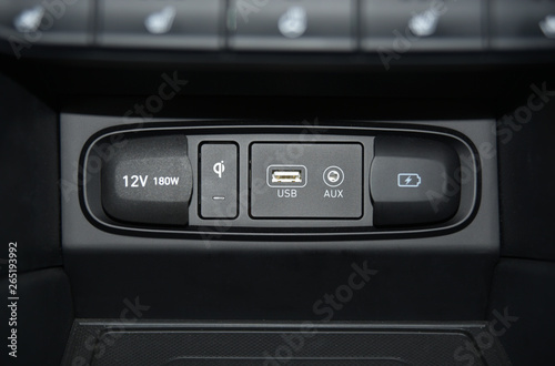 12V socket, wireless mobile phone charger, USB port, AUX port on car dashboard