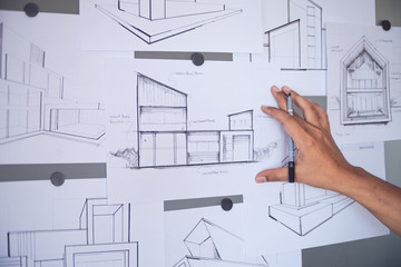 Naklejka na ściany i meble Architect Designer Engineer sketching drawing draft working Perspective Sketch design house construction Project