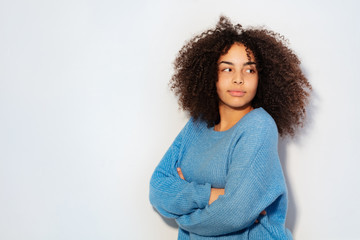 Portrait of thoughtful young black woman smiling