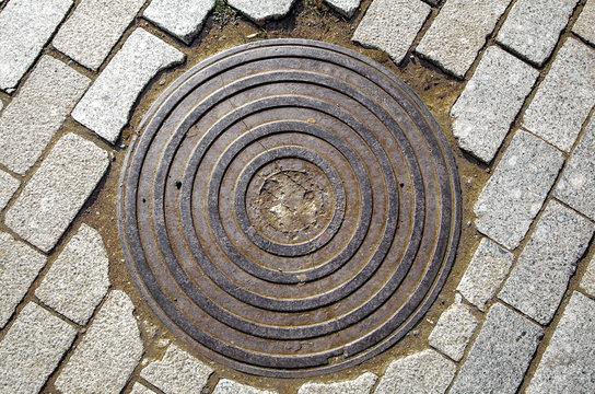 Manhole Cover On The Rubble, Repair Work On The Road