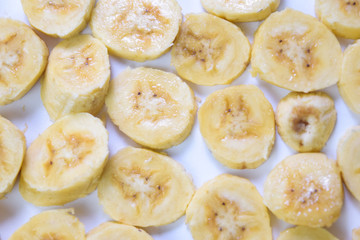 Close up slice yellow banana isolated on white background