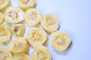 Close up slice yellow banana isolated on white background