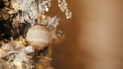 New Year's toys on a Christmas tree.Christmas background for postcard.Soft focus. Retro style. Copy space