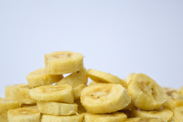 Close up slice yellow banana isolated on white background