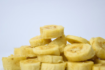 Close up slice yellow banana isolated on white background