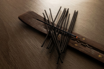 incense sticks with one lit incense stick