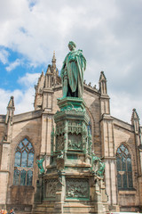 Fototapeta na wymiar Walter Francis Montagu Douglas Scott Statue on Parliament Square next to St Giles' Cathedral Edinburgh Scotland