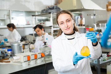 Fototapeta na wymiar Female student examining chemical substances