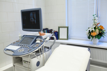 ultrasonographer unit for sonogram making for pregnant women, 3d mofel of fetus on screen
