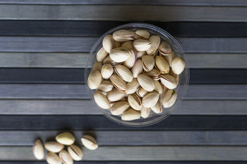 Healthy food  for background image close up pistachios nuts. Texture on top view Nuts pistachio on the cup plate