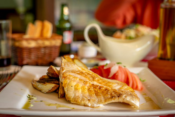 Chilean dish: Conger eel fried with potatoes and tomatoes