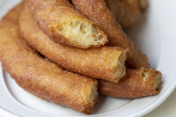 Close-up of delicious freshly made churros. Fried batons. (Porras madrileñas)