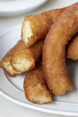 Close-up of delicious freshly made churros. Fried batons. (Porras madrileñas)