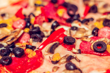 Closeup pizza top with various vegetables on it, different ingredients, spices, sauce and chees – Fast and fresh meal served in a restaurant