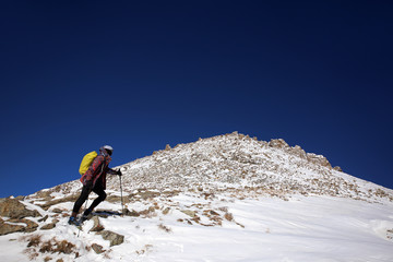 Naklejka na ściany i meble Climbing the Big Almaty peak in Kazakhstan.