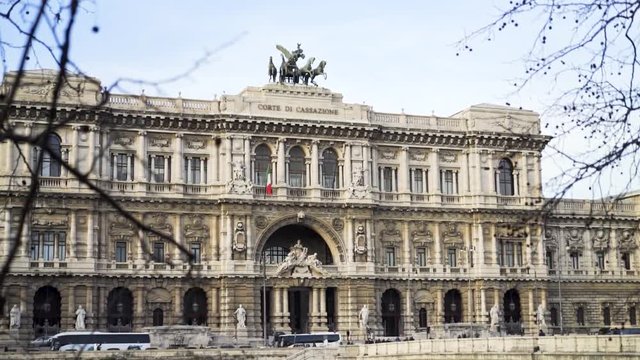 Palace of Justice against bright sky in Rome. Stock. Facade of the beautiful historical building in Italy in a summer day, architecture concept.