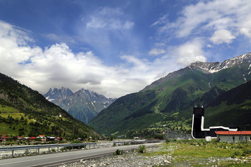 Mestia, Georgia - 07.17.2018: View of the building of the airport named after Queen Tamara against the backdrop of mountains in the high mountain village of Mestia in the Upper Svaneti region.