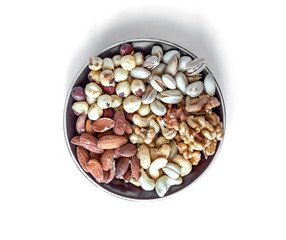 Healthy food. Nuts mix assortment on white grey table top view. Collection of different legumes for background image close up nuts, pistachios, almond, cashew nuts, peanut, walnut. image