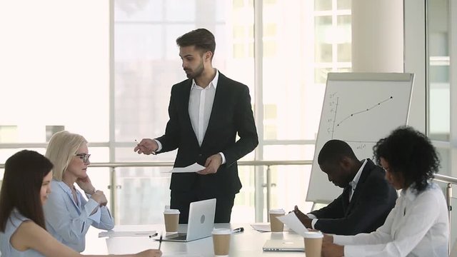 Mad manager boss scolding employees group shouting at office meeting