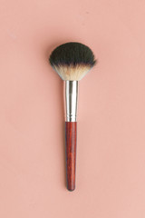 Makeup brush set, professional makeup tools, brushes for different functions on pink background