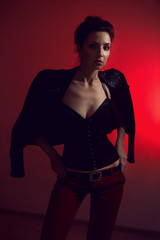 Fototapeta na wymiar beautiful sexy woman in fashionable black corset and black jacket