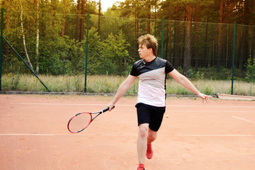 young tennis player in action on court during a training