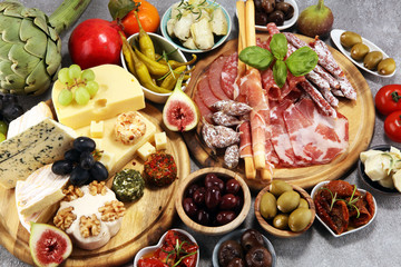 Italian antipasti wine snacks set. Cheese variety, Mediterranean olives, crudo, Prosciutto di...