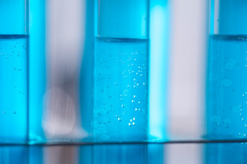 Test tube of glass overflows new liquid solution potassium blue conducts an analysis reaction takes various versions reagents using chemical pharmaceutics cancer manufacturing