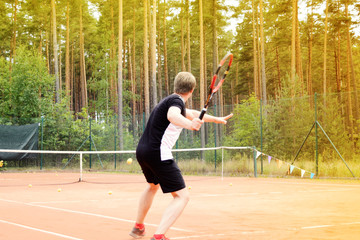 Obraz premium young tennis player in action on court during a match