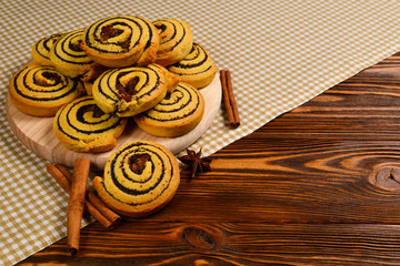 Home made baked cookies with raisins and poppy seeds. Space for text or design.