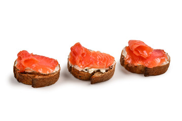 Salmon on a bread with cream isolated on white.