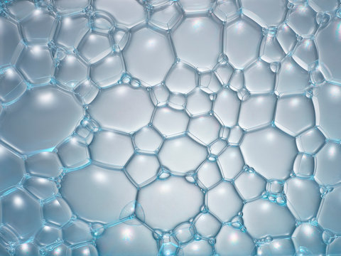 mousse de savon en macrophotographie, bulles de taille variable connectées entre elles