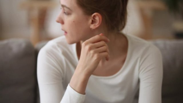 Sad young woman feeling stressed worried about unwanted pregnancy