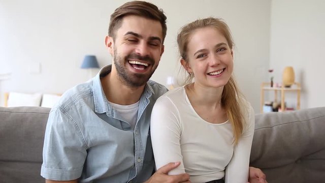 Happy couple vloggers recording vlog talking laughing looking at camera
