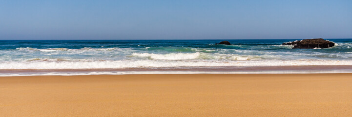 Fototapeta na wymiar Sandy beach with Rock formation, Atlantic ocean coastline of Portugal.