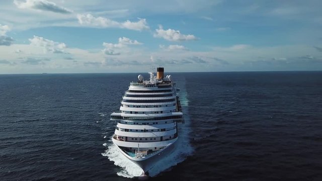 Stunning aerial view of the cruise ship in open water, front view. Stock. Front part of an anchored ocean liner sailing in the Pacific ocean.