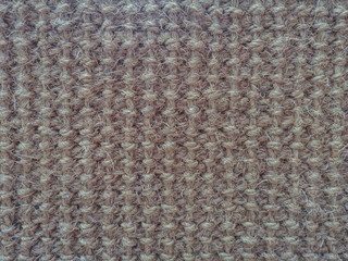 Close up texture made from dry coconut fiber background.Close up surface texture of hand made craft work dried coconut leaves woven patterns for texture.