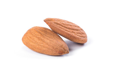 Two almonds on a white background, close up. healthy food.