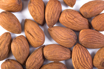 Background of big crude almonds, close up, top view.