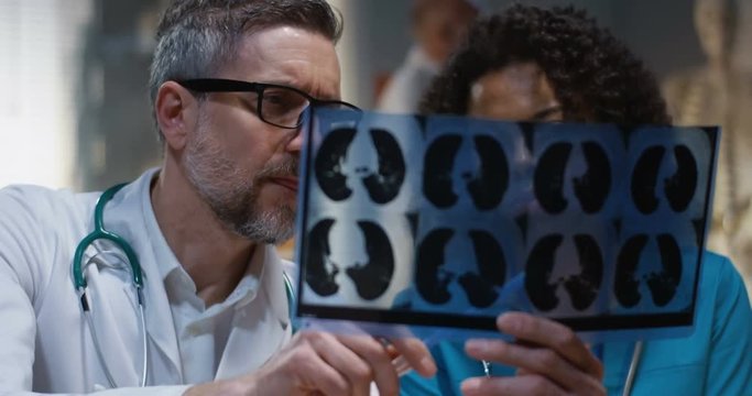 Doctors analyzing MRI scan results