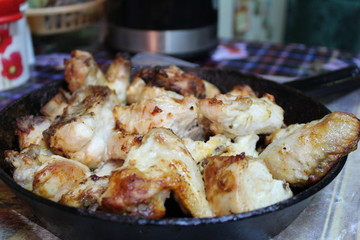 fried appetizing chicken in a pan. roasting in the oven in the home kitchen.meat with a Golden crust.home-cooked food is healthy, tasty and appetizing.