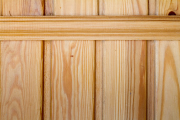 Closeup of wooden boards fastened by a cross bar, the theme of environmental friendliness.